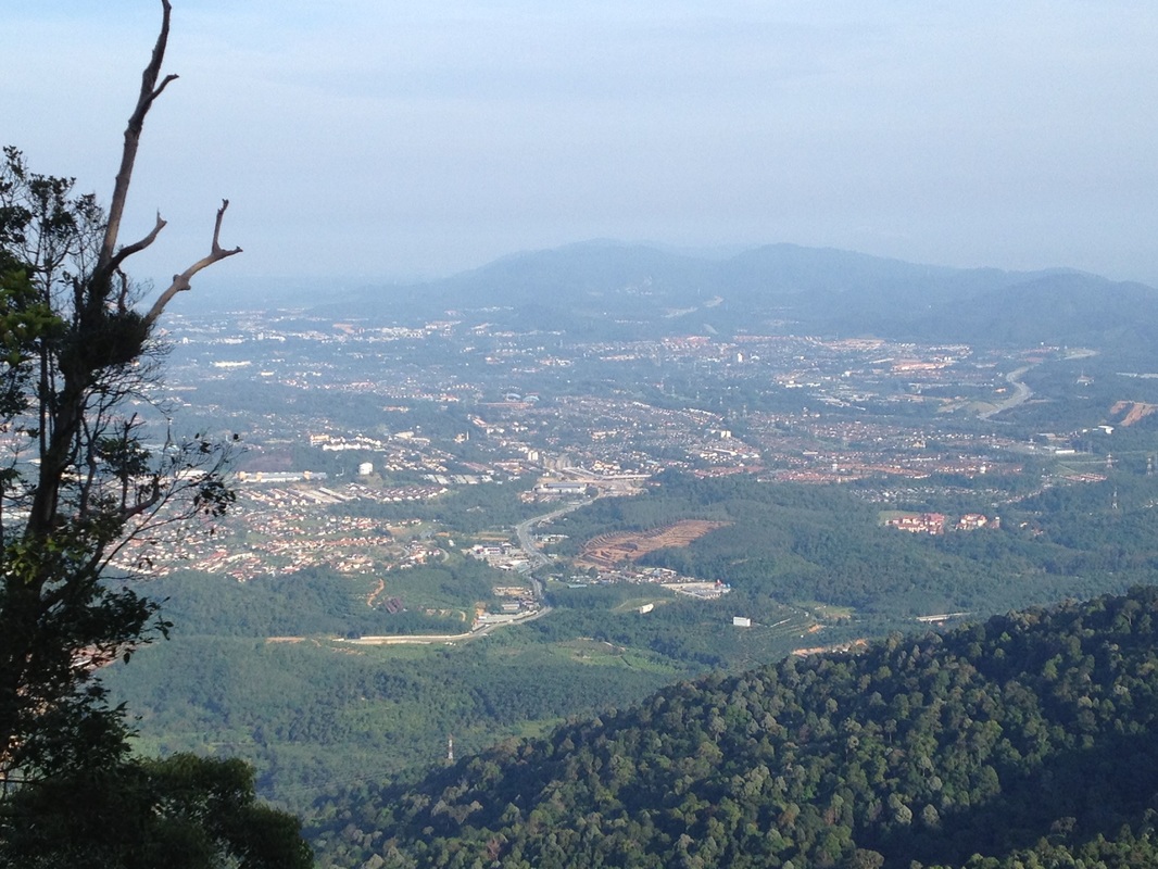 View of Seremban town. The main road in the middle of the picture is Jalan Kuala Pilah. The messy built-up area just to the top of Jalan Kuala Pilah is the junction between LEKAS and Jalan Kuala Pilah which is still under construction. The two mountains at the background are Gunung Gallah and Gunung Penda. Seremban town centre itself is at the top-left