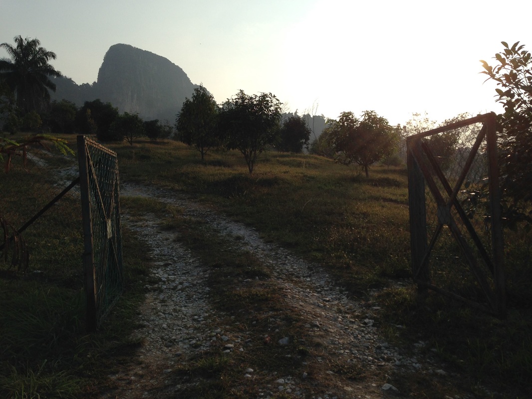 The gate that leads into the farm compound. The gate also frames the peak of Tabur Extreme very nicely in this picture