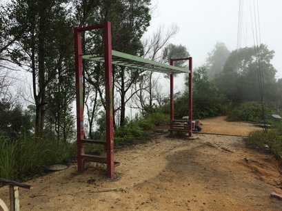 An additional flight of steps leads to the exercise station replete with monkey bars and push up bars
