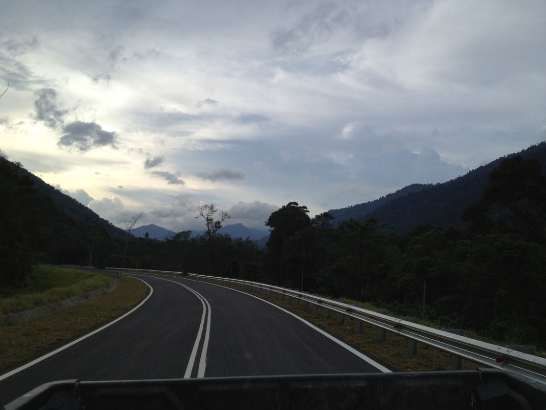 Gunung Besar Hantu is the mountain on the right (in the far distance under the darkish cloud