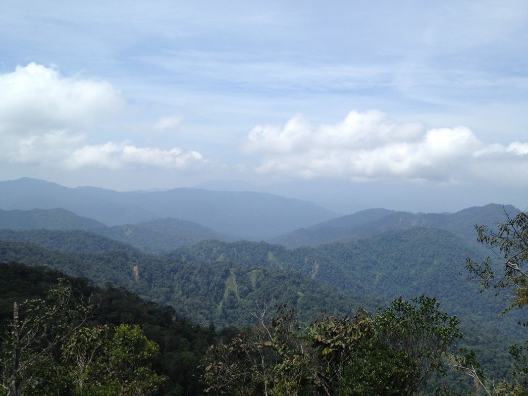 View to the west, faraway in the distance, just visible under the cloud is mighty Gunung Benum